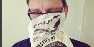 Peter eating pasties in St Ives, whilst on a self catering holiday.