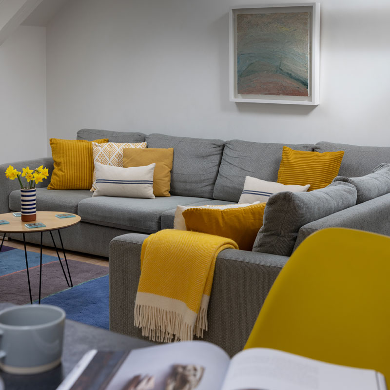 Bay - Yellow throw on sofa