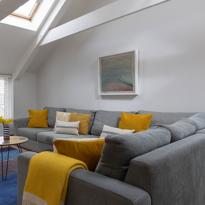 Bay - Sofa and yellow blanket